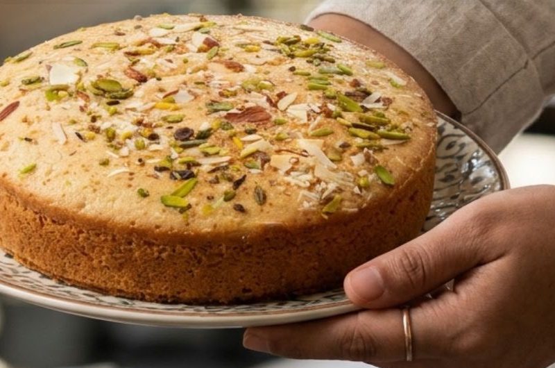 Mawa cake topped with pistachios and almonds